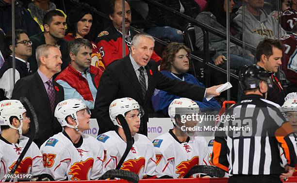 Head coach Bob Hartley of the Calgary Flames talks to an official during the game against the Colorado Avalanche at the Pepsi Center on November 3,...