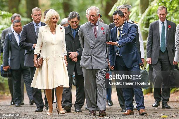 Prince Charles, Prince of Wales, and Camilla, Duchess of Cornwall walk through native bush on their way to the 'Tea With Taranaki' event at...