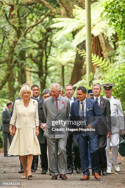 Prince Charles, Prince of Wales, and Camilla, Duchess of Cornwall walk through native bush on their way to the 'Tea With Taranaki' event at...