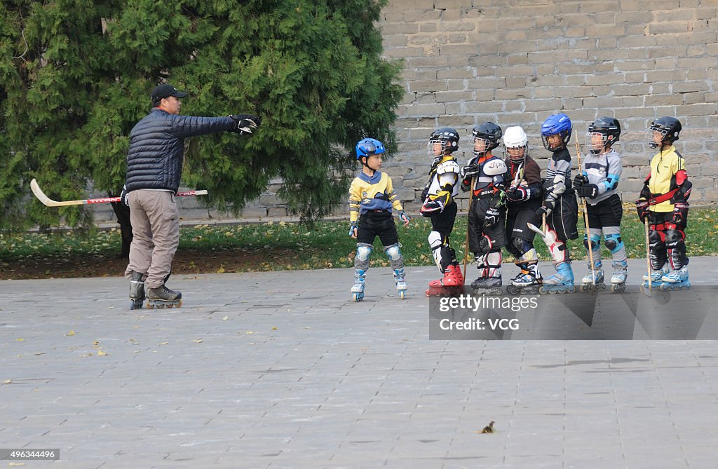 Children Practice Ice Hokey At Temple Of Earth In Beijing