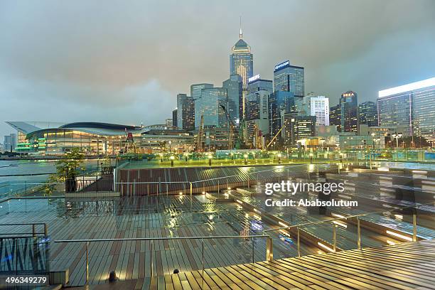 convention center and central plaza, evening, hong kong - hong kong convention and exhibition centre stock pictures, royalty-free photos & images