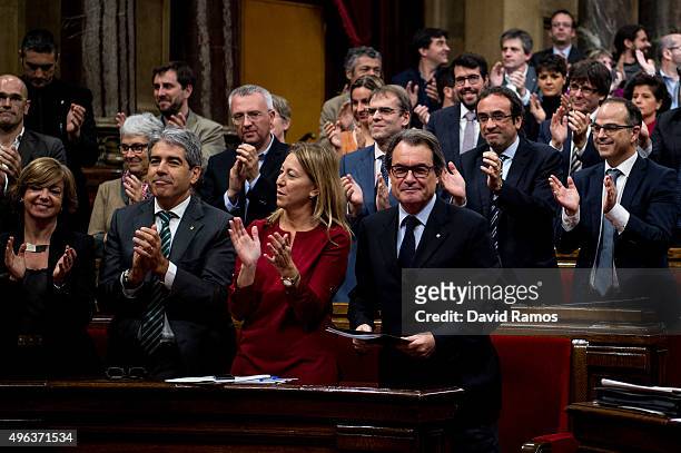 Acting President of Catalonia Artur Mas looks on as Junts Pel Si members of the Catalan parliament celebrate at the end of the parliamentary session...