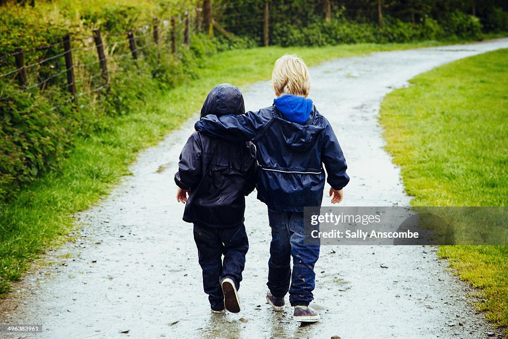 Two little brothers walking together