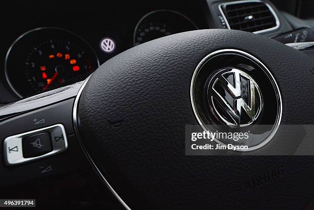 The Volkswagen logo is pictured on the steering wheel of a Polo model car on November 9, 2015 in London, England. Scandinavian Asset Management...