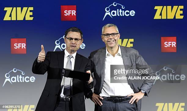 The CEO of the French telecommunications company SFR Eric Denoyer and Michel Combes, both Chief Operating Officer of the Group Altice and Chairman of...