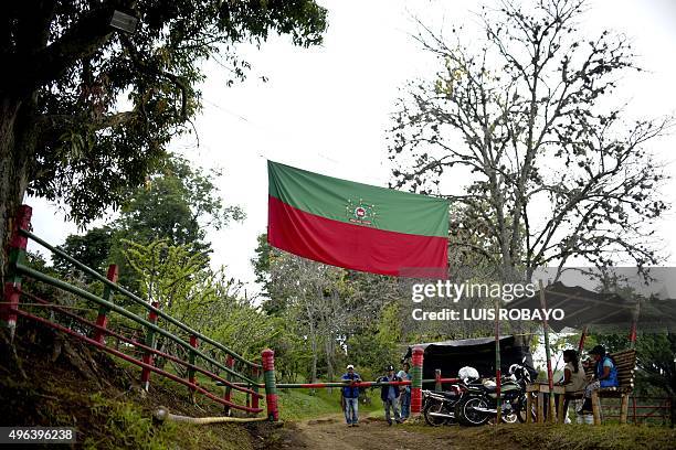 Colombian natives guard the entrance to the Gualanday Harmonization Center where their leader Feliciano Valencia is confined, in a rural area of...