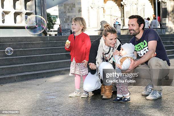 Sophie Schuett, her children Shaza Maria Schuett and Lonzo Henry Schuett and her partner Felix Seitz pose during a family photo session September 27,...