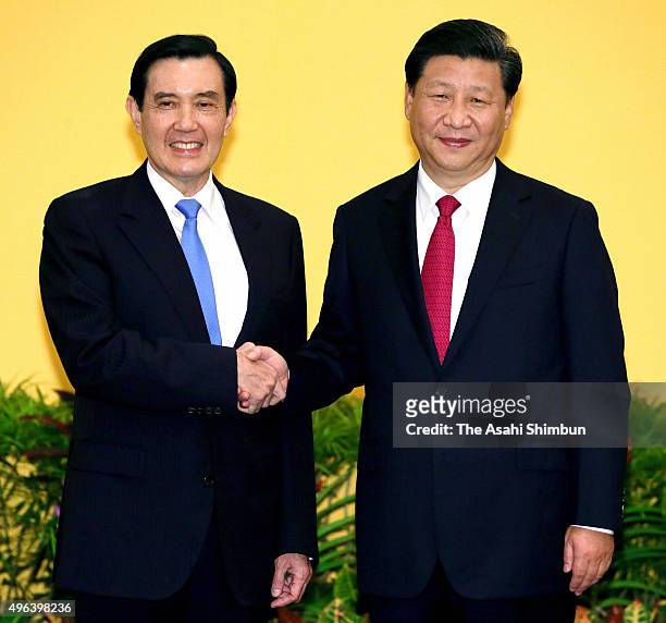 Chinese President Xi Jinping and Taiwanese President Ma Ying-Jeou shake hands prior to their meeting at a hotel on November 7, 2015 in Singapore.