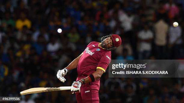 West Indies cricketer Kieron Pollard avoids a bouncer off Sri Lankan cricketer Dushmantha Chameera during the first T20 International cricket match...