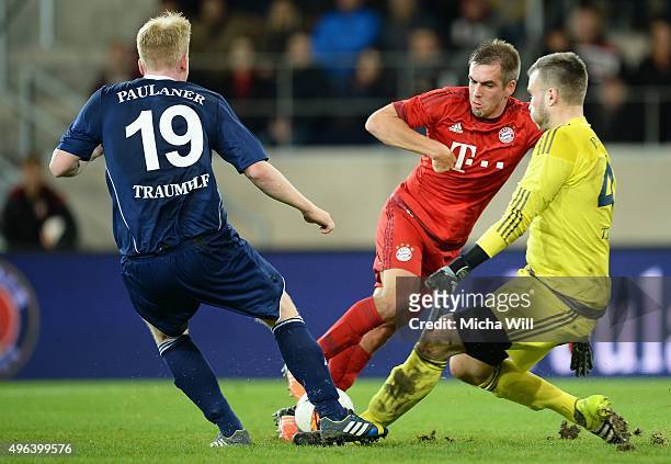 Josip Grgic of Paulaner Traumelf, Philipp Lahm of Muenchen and Dominik Forster, goalkeeper of Paulaner Traumelf compete for the ball during the...