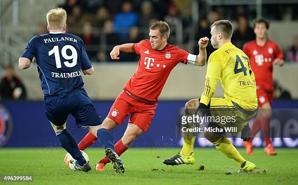 Josip Grgic of Paulaner Traumelf, Philipp Lahm of Muenchen and Dominik Forster, goalkeeper of Paulaner Traumelf compete for the ball during the...