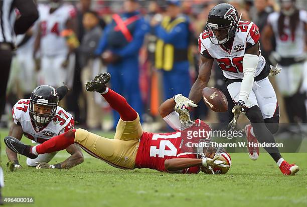 Phillip Adams of the Atlanta Falcons intercepts this pass that was deflected off the hands of Jerome Simpson of the San Francisco 49ers during the...