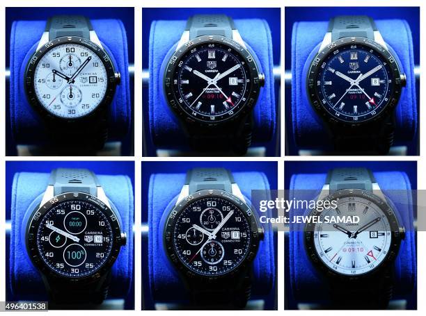 This combinations of pictures shows a TAG Heuer titanium Carrera Connected watch with various watch-faces during its launch in New York on November...