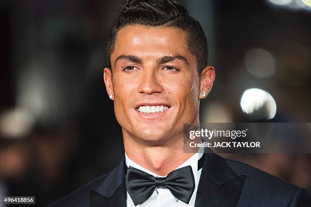 Real Madrid's Portuguese forward Cristiano Ronaldo poses on arrival for the world premiere of the film Ronaldo in central London on November 9, 2015....