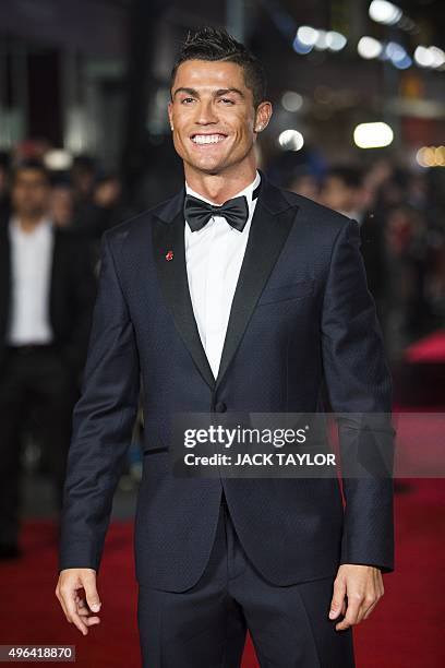 Real Madrid's Portuguese forward Cristiano Ronaldo poses on arrival for the world premiere of the film Ronaldo in central London on November 9, 2015....