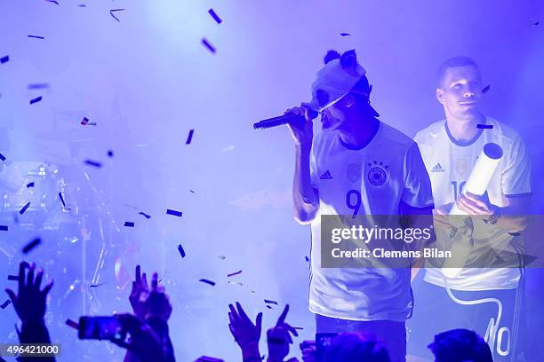 Cro and Lukas Podolski attend the 'Die Mannschaft' Kit Presentation at The Base on November 9, 2015 in Berlin, Germany.