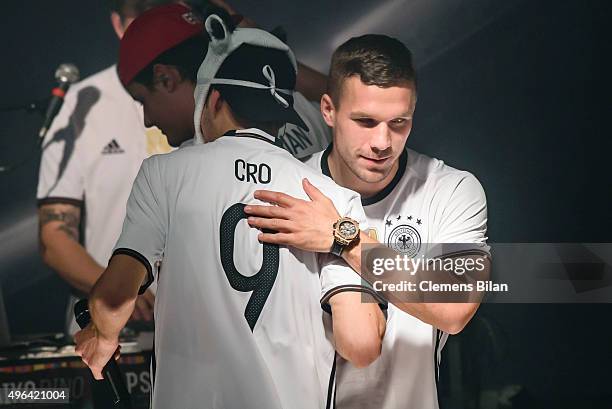 Cro and Lukas Podolski attend the 'Die Mannschaft' Kit Presentation at The Base on November 9, 2015 in Berlin, Germany.