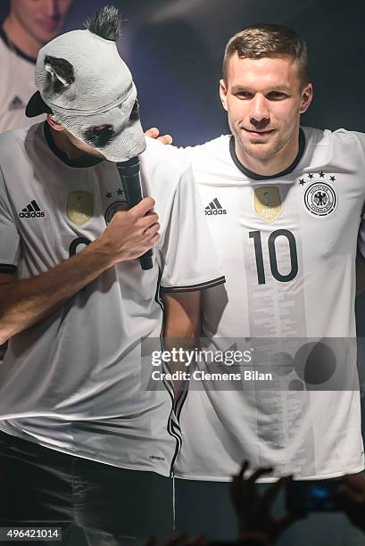 Cro and Lukas Podolski attend the 'Die Mannschaft' Kit Presentation at The Base on November 9, 2015 in Berlin, Germany.