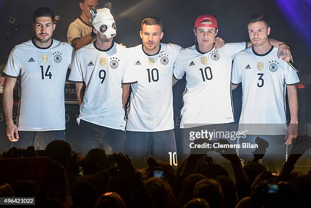 Emre Can, Cro, Lukas Podolski, a guest and Jonas Hector attend the 'Die Mannschaft' Kit Presentation at The Base on November 9, 2015 in Berlin,...