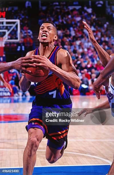 Kevin Johnson of the Phoenix Suns drives against the Sacramento Kings circa 1993 at Arco Arena in Sacramento, California. NOTE TO USER: User...