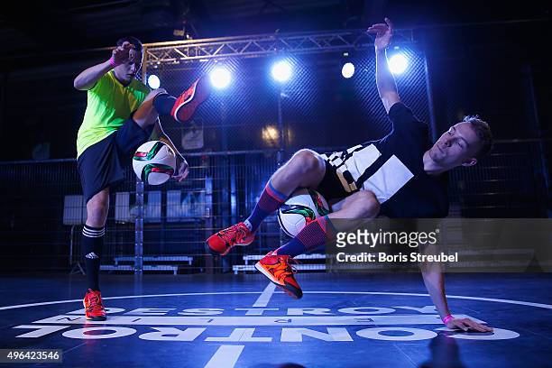 Two trick footballers perform at the adidas presentation of the new DFB home jersey for UEFA EURO 2016 at The Base on November 9, 2015 in Berlin,...