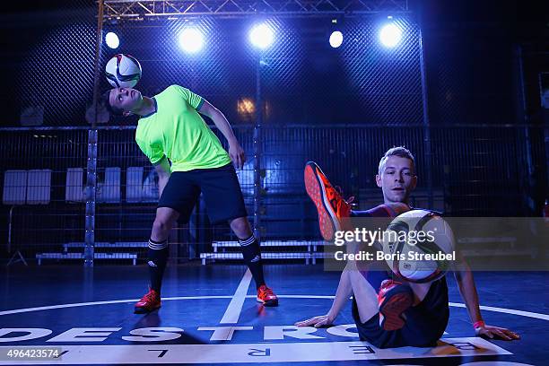 Two trick footballers perform at the adidas presentation of the new DFB home jersey for UEFA EURO 2016 at The Base on November 9, 2015 in Berlin,...