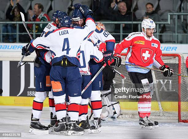 Marek Daloga, Patrik Luza , Martin Reway and Pavol Skalicky of Team Slovakia celebrate after scoring the 1:0 next to Phil Baltisberger of Team Swiss...