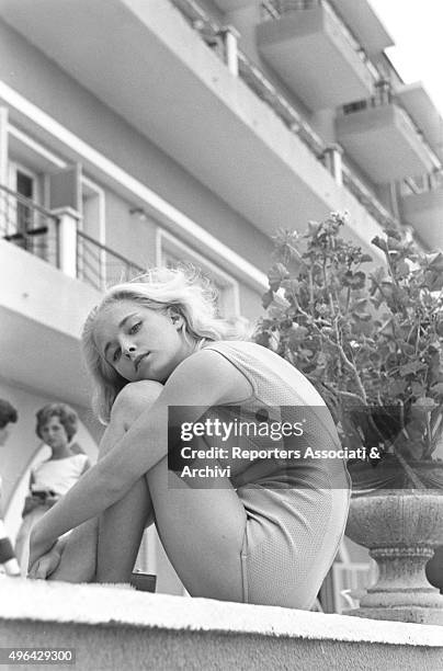 The young British actress Jill Haworth sitting on a fence during a break on the set of the film Exodus. Cyprus, 1960