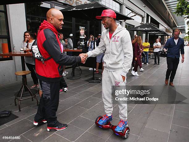 Charles Hatley of the USA shjakes a boxing fans hand as he leaves on a Segway after the weigh in ahead of tomorrow night's fight against Anthony...