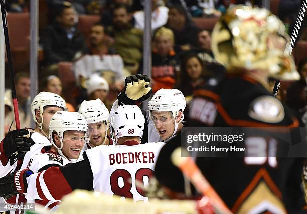 Max Domi of the Arizona Coyotes celebrates his goal of the game with Mikkel Boedker, Michael Stone and Dustin Jeffrey behind Frederik Andersen of the...