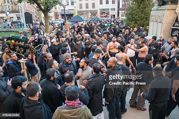 The crowd of Muharram participants gathers in the plaza next to Jersey City's City Hall. Shia Muslims gathered in Jersey City to commemorate the...