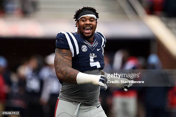 Robert Nkemdiche of the Mississippi Rebels participates in warmups prior to a game against the Arkansas Razorbacks at Vaught-Hemingway Stadium on...
