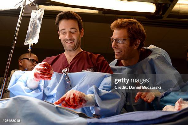 Actors Colin Donnell and Nick Gehlfuss perform an on set demonstration of "Chicago Med" during the press junket for NBC's 'Chicago Fire', 'Chicago...