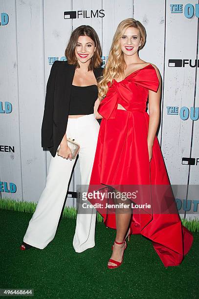 Actresses Olivia Stuk and Caroline Sunshine arrive at the Fullscreen Films presents the premiere of "The Outfield" at AMC CityWalk Stadium 19 at...