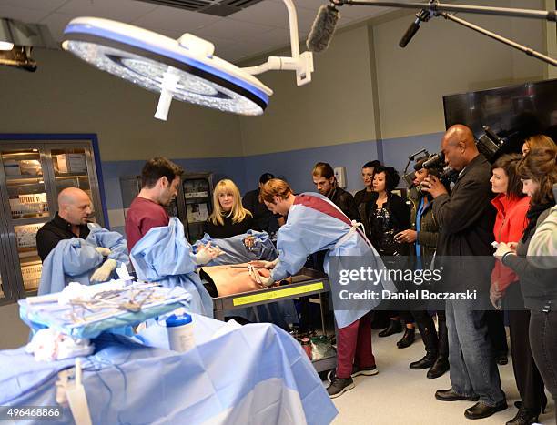 Dr. Andrew Dennis and Susie Schelling consult actors Colin Donnell and Nick Gehlfuss as they perform an on set demonstration of "Chicago Med" during...