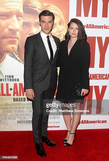 Actor Finn Wittrock and Sarah Roberts attend the premiere of Clarius Entertainment's "My All American" at The Grove on November 9, 2015 in Los...