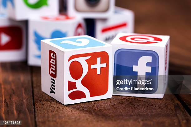 social media cubes on a wooden background - google social networking service stock pictures, royalty-free photos & images
