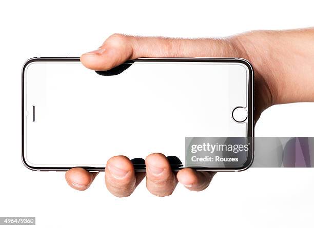 hand holding iphone 6s plus on white background - iphone 6 hand stock pictures, royalty-free photos & images