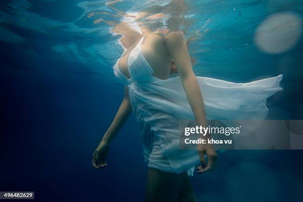 walking in water - white dress stock pictures, royalty-free photos & images