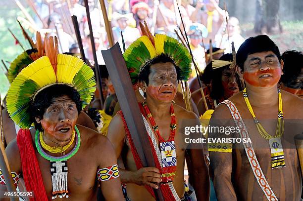 Natives from the Kayapo and Pataxo ethnic groups perform a warrior dance during a protest in front of the Congress as the lawmakers discuss the law...