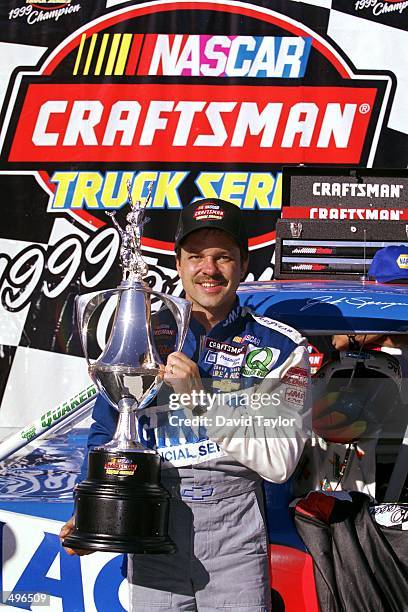 Jack Sprague poses with his trophy after winning the NAPA Auto Parts 200, part of the NASCAR Craftsman Truck Series, at the California Speedway in...