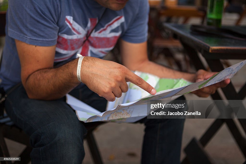 Man looking at a map of Rio de Janeiro