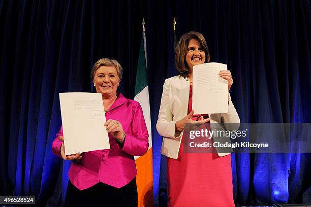 The Irish Minister for Justice and Equality, Frances Fitzgerald shows her signed commencement order for the Marriage Act 2015 as the Tanaiste Joan...