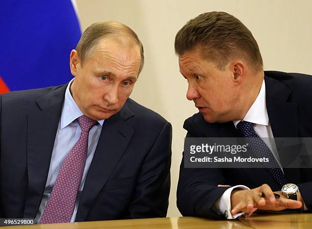 Russian President Vladimir Putin listens to Gazprom CEO Alexei Miller during a Russian-Kuwait meeting in Bocharov Ruchey State Residence on November...
