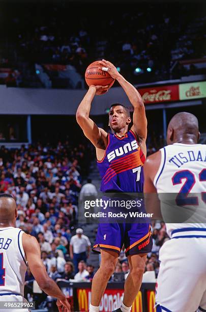 Kevin Johnson of the Phoenix Suns shoots against the Sacramento Kings circa 1993 at Arco Arena in Sacramento, California. NOTE TO USER: User...