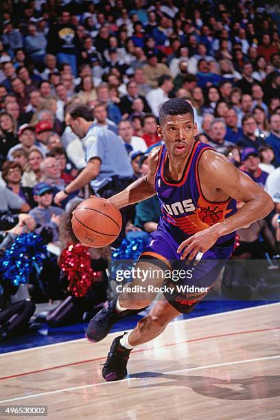 Kevin Johnson of the Phoenix Suns drives against the Sacramento Kings circa 1993 at Arco Arena in Sacramento, California. NOTE TO USER: User...