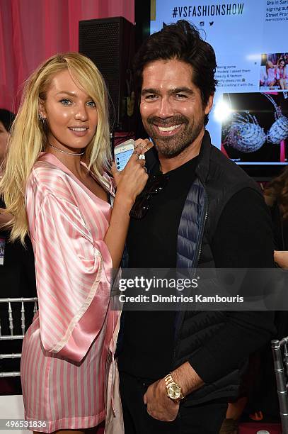 Candice Swanepoel and shoe designer Brian Atwood are seen backstage before the 2015 Victoria's Secret Fashion Show at Lexington Avenue Armory on...