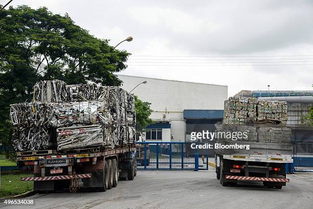Trucks carrying bales of aluminum wait to enter the Latasa Reciclagem SA collection center for recycling in Pindamonhangaba, Brazil, on Thursday,...
