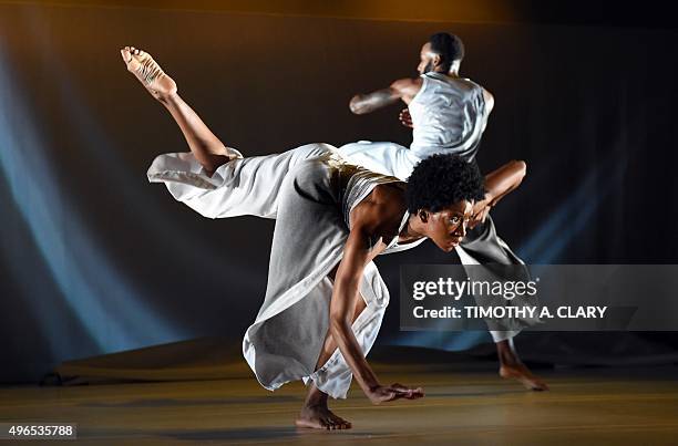 Dancers Tamisha Guy and Jeremy "Jae" Neal with Abraham.In.Motion perform a scene from "Absent Matter" during a dress rehearsal before opening night...