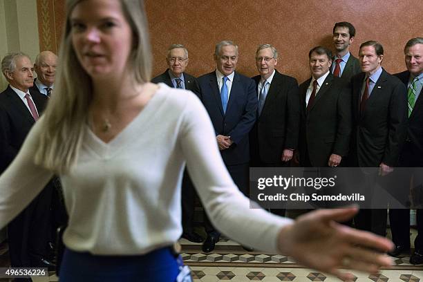 Staff member ushers photographers out of the room after Israeli Prime Minister Benjamin Netanyahu posed for photographs with Sen. Bob Corker , Sen....